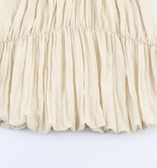Beige pleated skirt on a white background