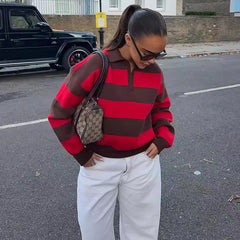 Model wearing blue and navy striped knit polo top