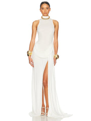 Woman wearing a white sleeveless gown with a high slit on a white background