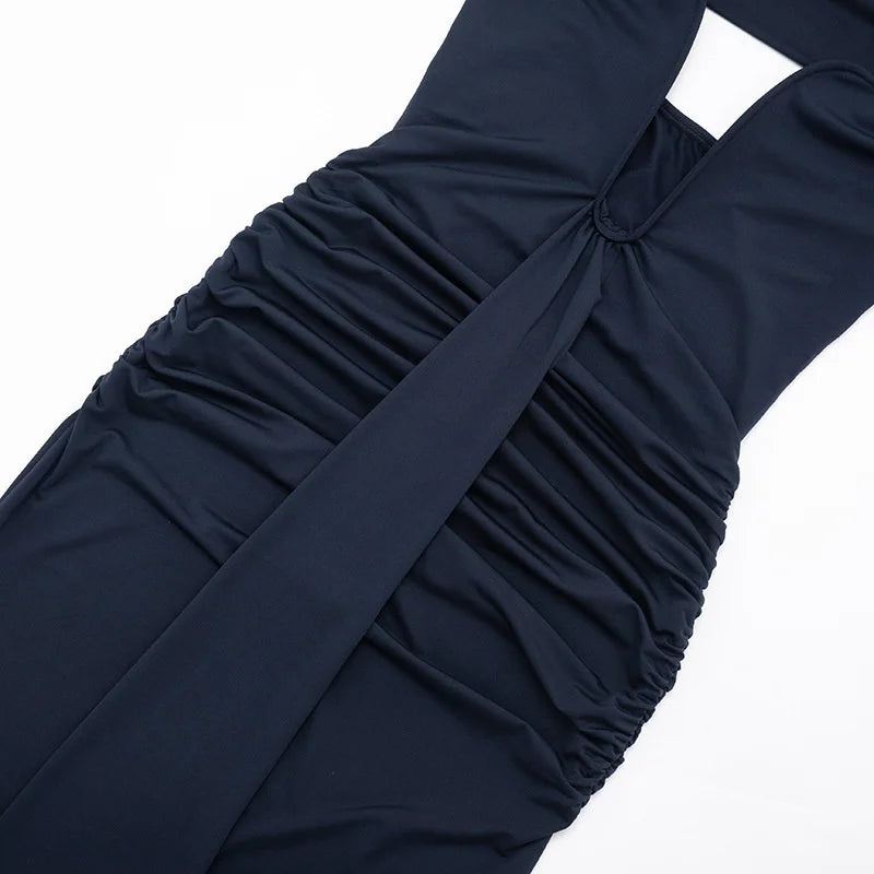 Navy blue dress with a wide strap and knot detail on a white background