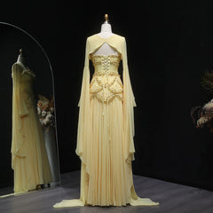 Elegant yellow evening gown on a mannequin against a dark background