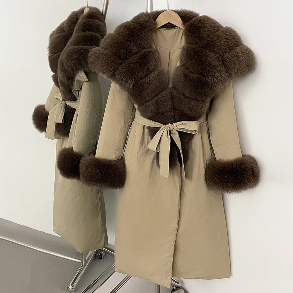 Beige coat with brown fur trim on a hanger