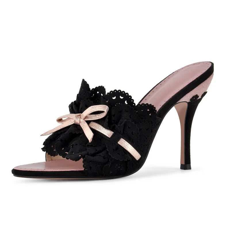 Black eyelet lace stiletto heel with ruffled bow and pink lining