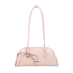 Pale pink patent leather shoulder bag with matching handles and a silver heart charm.
