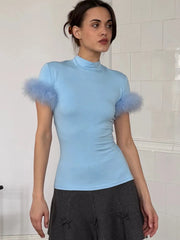 Light blue mock neck feather trim top