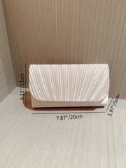 An elegant satin clutch bag with pleated details and rhinestones, perfect for a wedding or formal event.