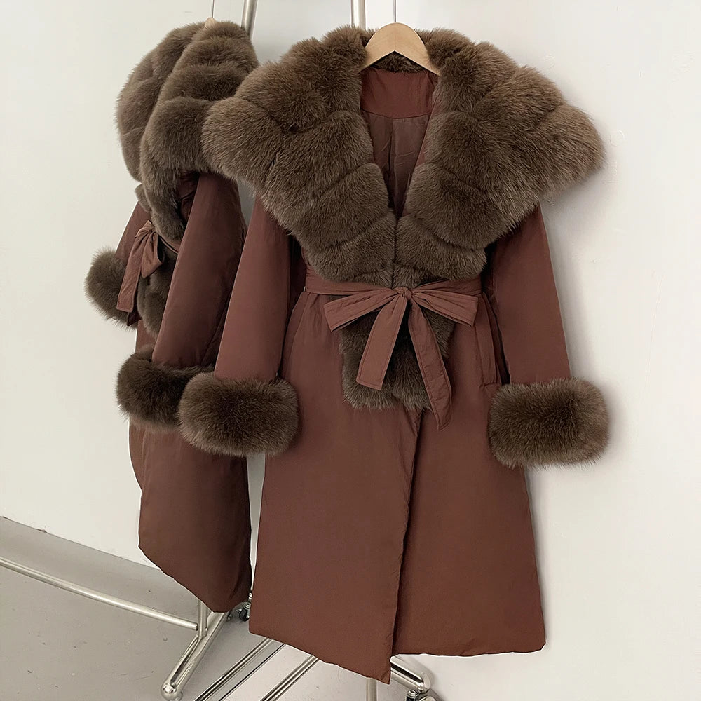 Brown coat with fur trim on a hanger 