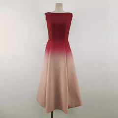 Ombre dress transitioning from red to beige on a mannequin against a white background