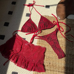 Red lace bikini set laid flat