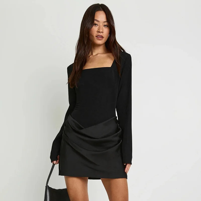 Elegant mini dress styled with subtle sculpted structure
