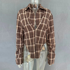 Brown plaid shirt on a mannequin against a gray background