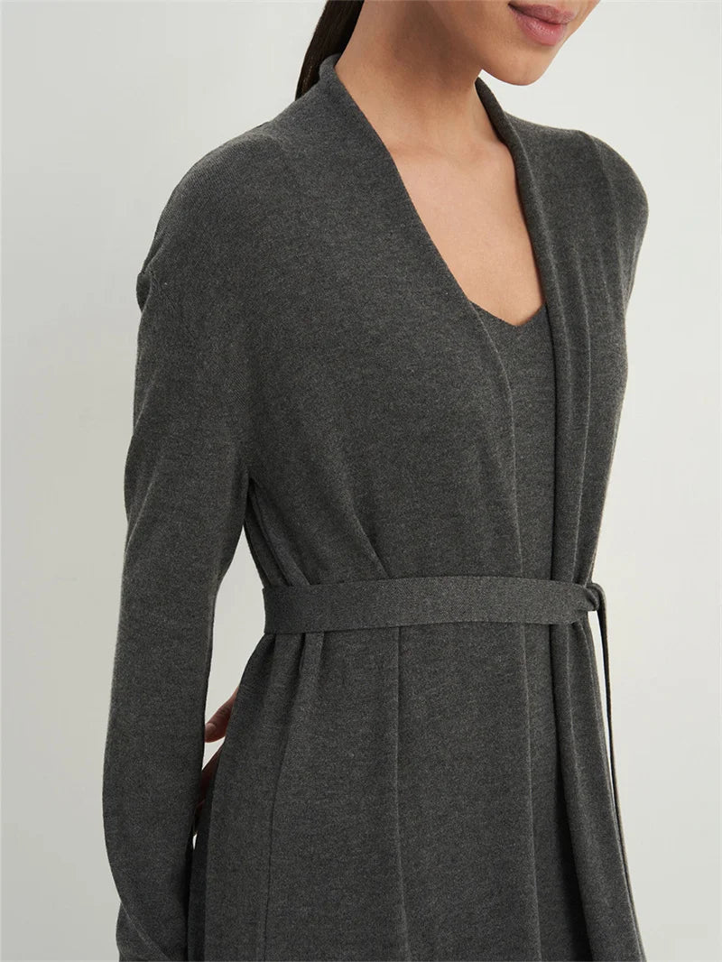 Gray robe worn by a person on a light gray background