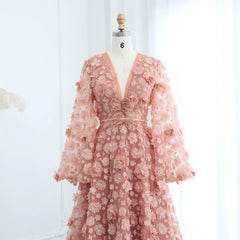 Mannequin displaying  the blush pink 3D floral gown, showcasing its elegant silhouette and romantic bell sleeves. Golden Atelier 3