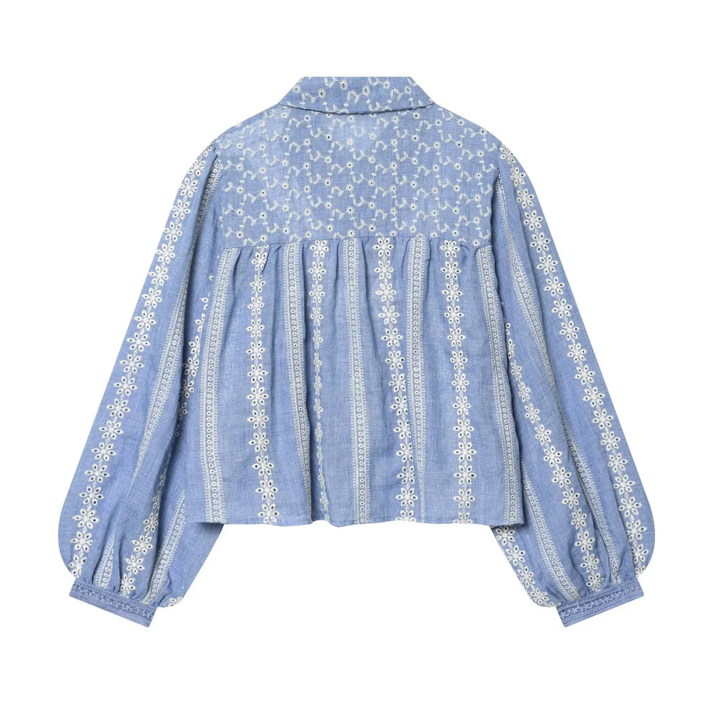 Back view of blue embroidered puff sleeve casual blouse