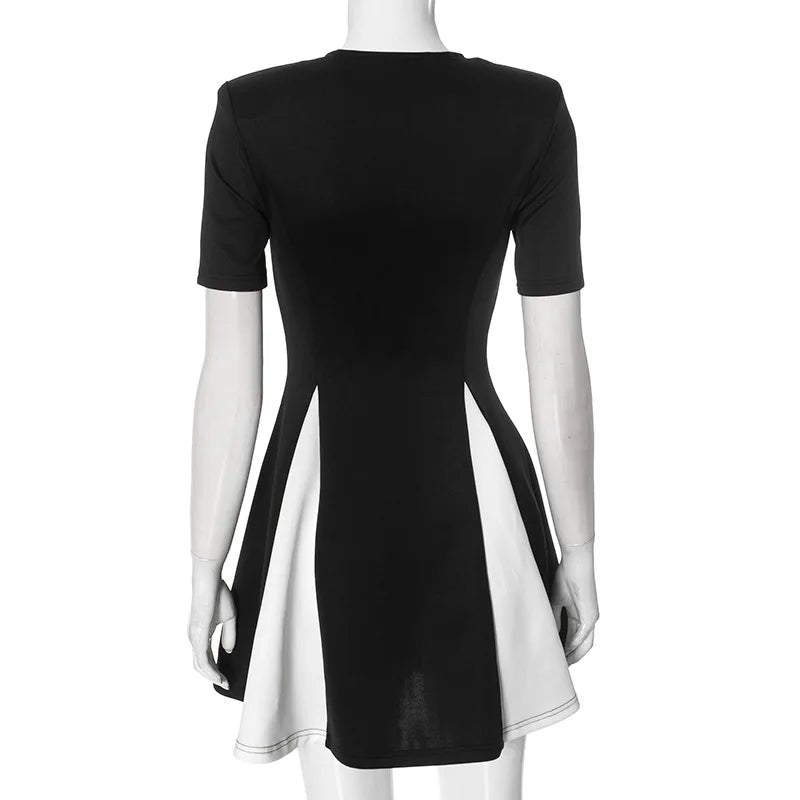 Black and white dress on a mannequin against a white background