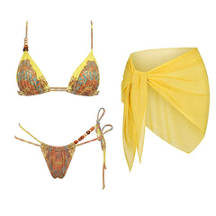 Yellow print triangle bikini with beaded embellishments and a matching wrap skirt.