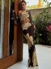 Brown floral print one-shoulder crop top and flowing maxi skirt set
