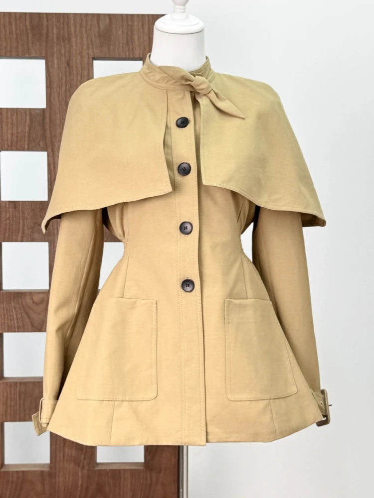 Beige cape coat on a mannequin 