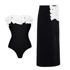 Strapless swimsuit with white floral appliqués and matching high-waist maxi skirt