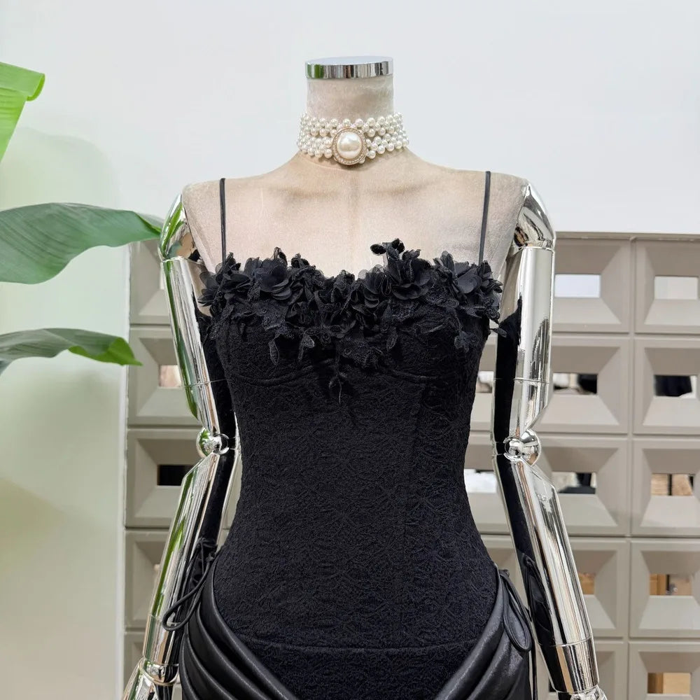 Close-up of black floral lace neckline on mini dress