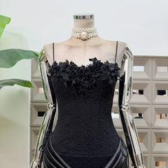 Close-up of black floral lace neckline on mini dress