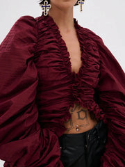 Close-up of ruched V-neck puff sleeve blouse