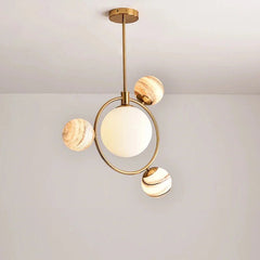 Modern chandelier with gold and white design on a plain background