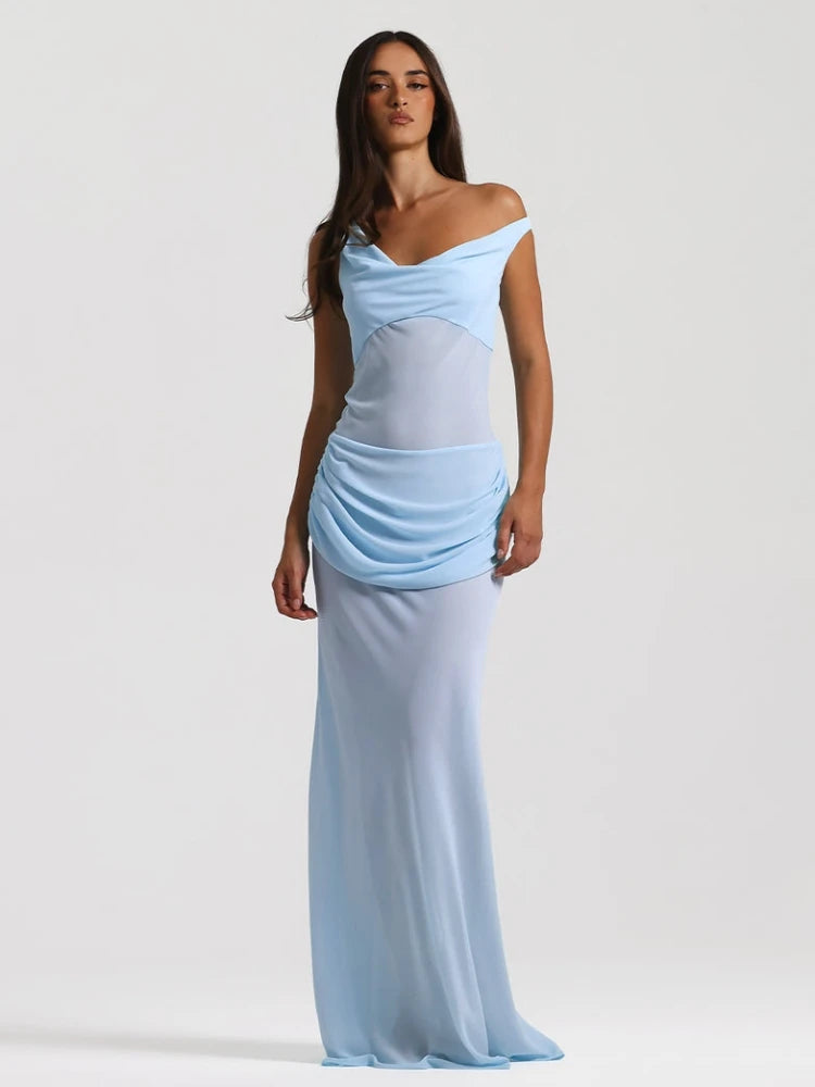 Woman wearing a light blue off-shoulder gown on a white background