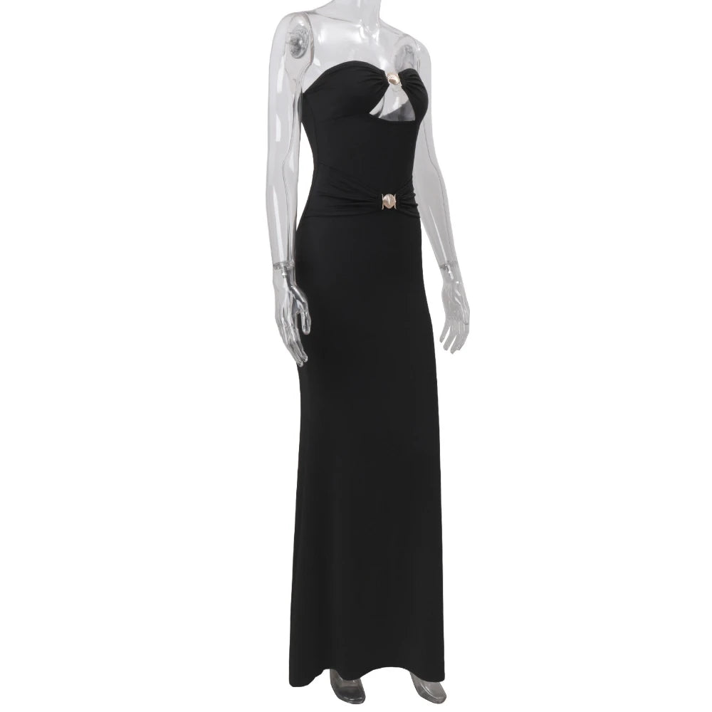Black evening gown on a mannequin against a white background