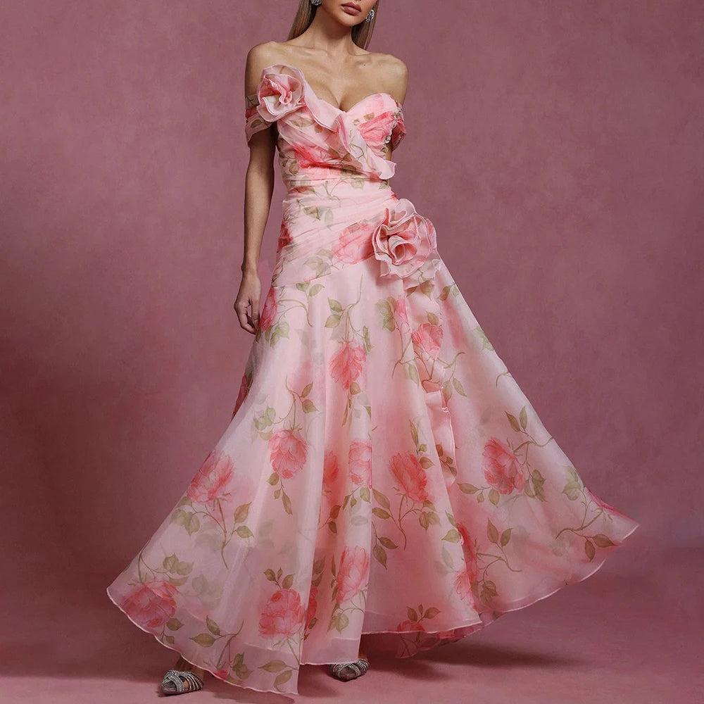 Woman wearing a pink floral dress against a matching pink background