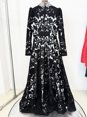 Back view of black embroidered mesh maxi dress with beaded collar on a hanger.