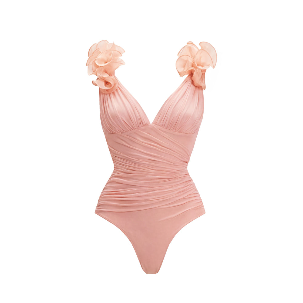 Close-up of the ruched V-neck swimsuit with floral shoulder embellishments