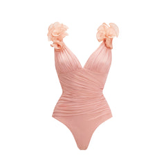 Close-up of the ruched V-neck swimsuit with floral shoulder embellishments