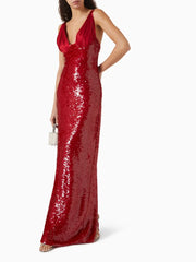 Refined red formal gown with deep neckline and sparkling surface