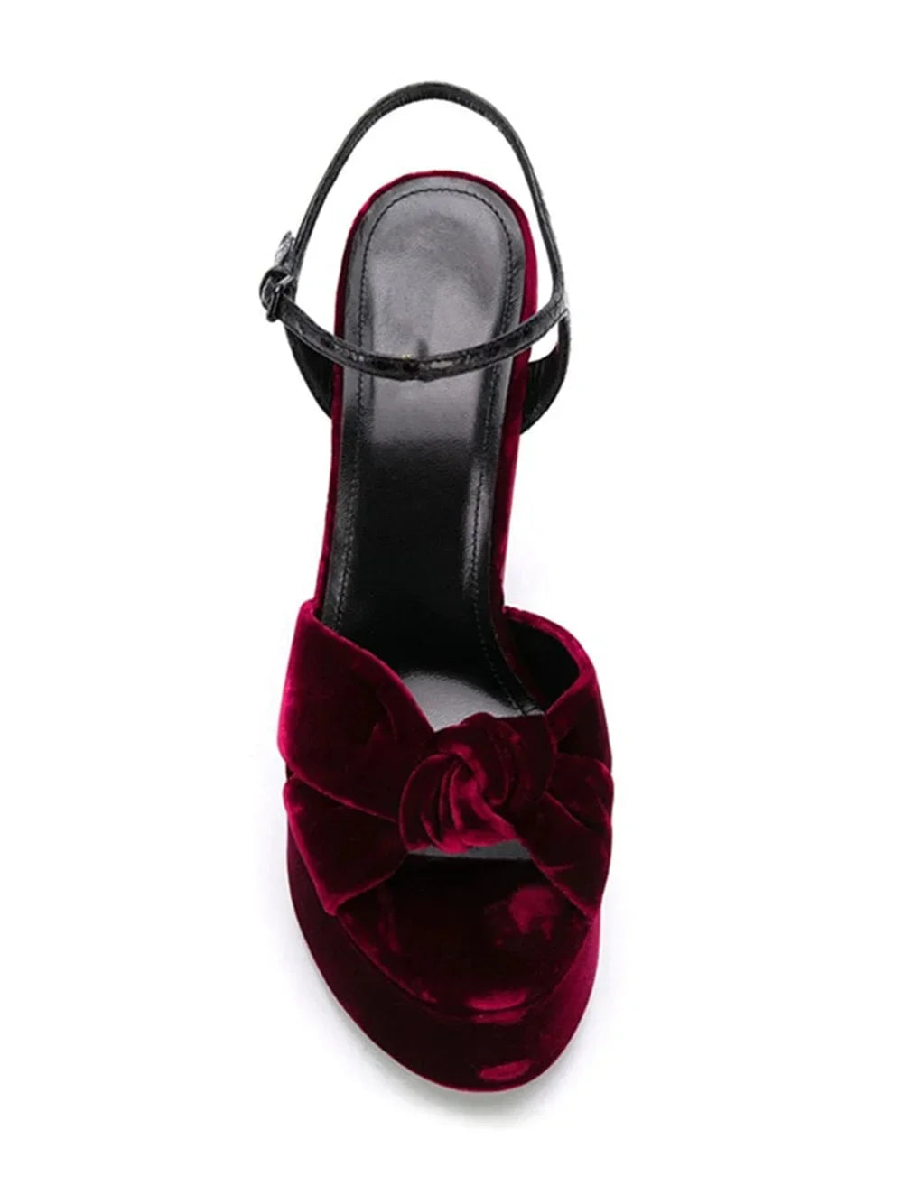 Top-down view of a burgundy velvet platform slingback heel with knot detail.
