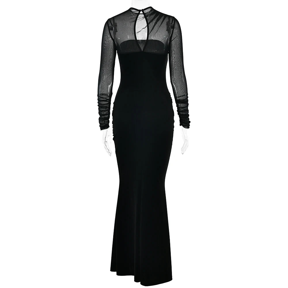 Black evening gown with sheer long sleeves on a white background