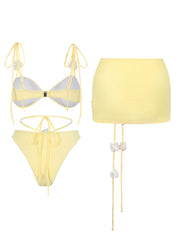 Back view of yellow bow tie triangle bikini top and ruched skirt two-piece set