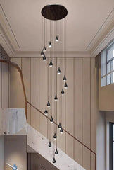  Sleek modern LED pendant lights hanging in a contemporary stair case setting . Golden Atelier 2