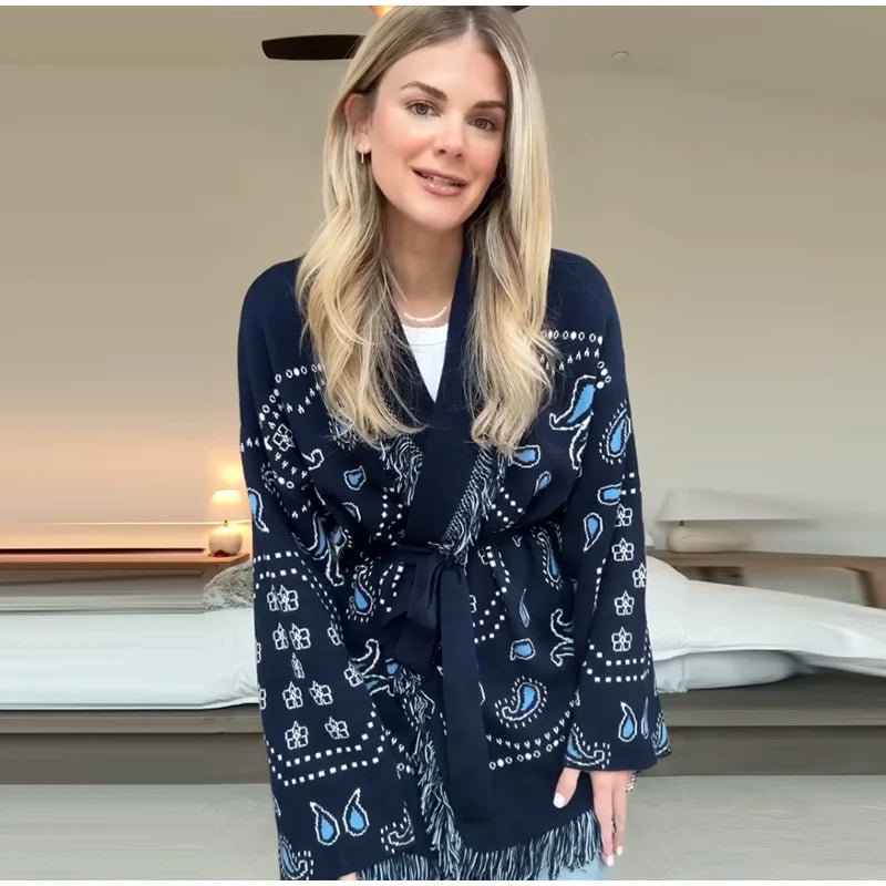 Woman wearing a navy blue patterned robe indoors.