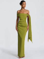 Woman wearing a green off-shoulder gown 
