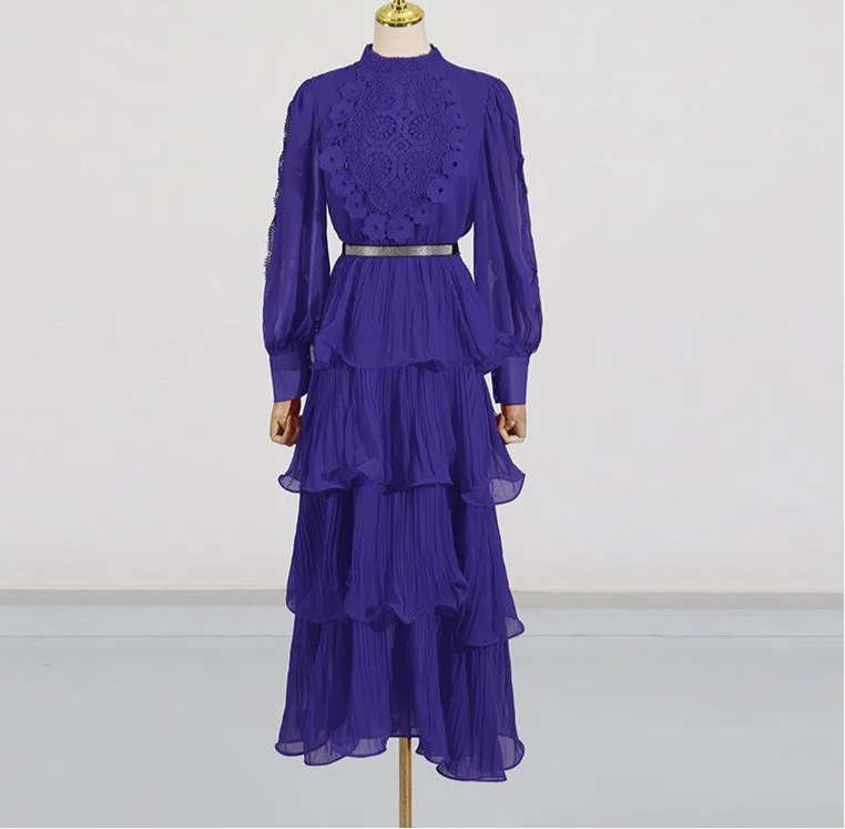 Purple lace top and tiered skirt on a mannequin against a white background