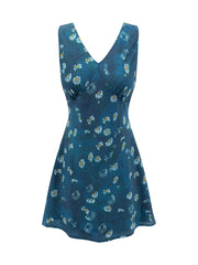 Sleeveless V-neck A-line mini dress with a blue background and white daisy print, displayed flat.