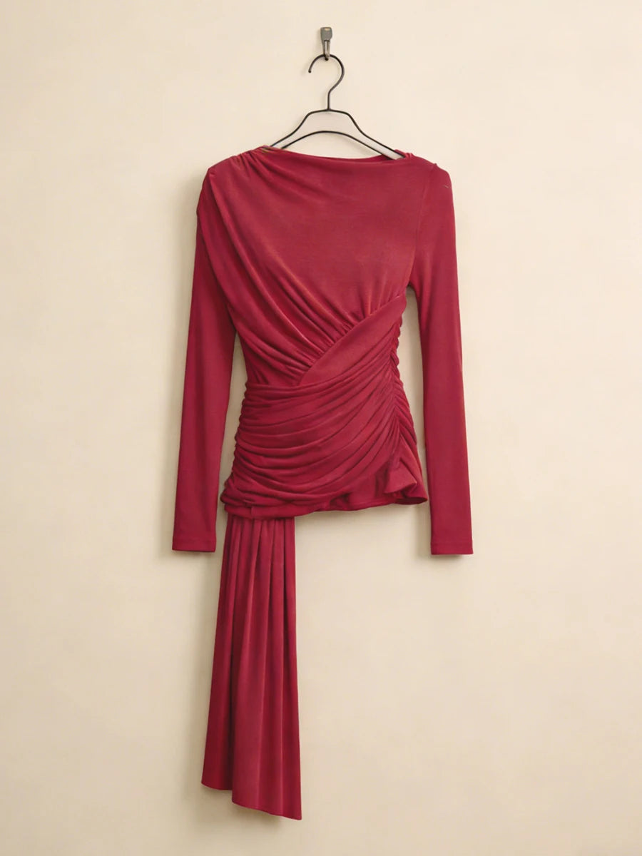 Red dress with long sleeves on a beige background