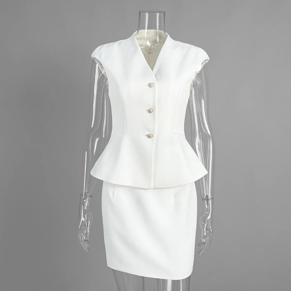 White suit on a mannequin against a gray background