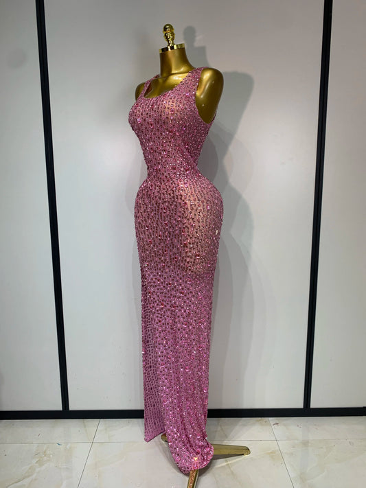 Side view of a sleeveless V-neck crystal embellished bodycon floor-length pink dress