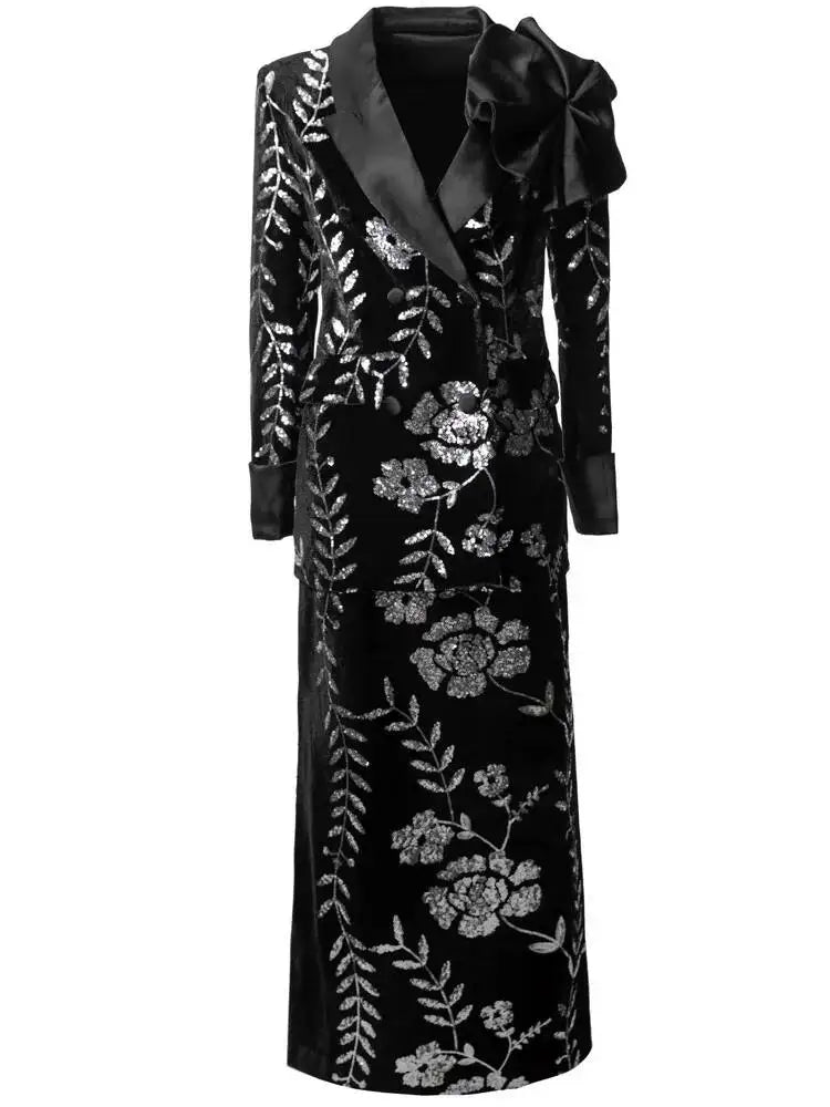 Full length view of black sequined floral blazer and split skirt suit