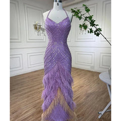 Purple beaded evening gown on a mannequin against a white paneled wall.