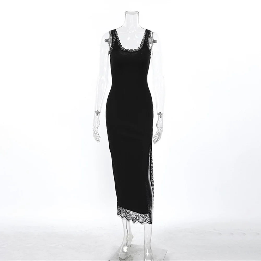 Black dress with lace details on a mannequin against a white background