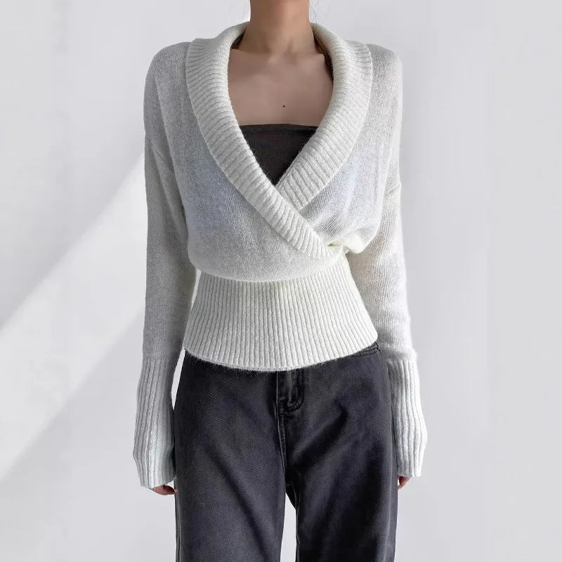 White knit wrap top with deep V-neck and long sleeves