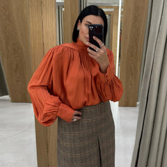 Standneck long sleeve blouse with fold ribbon and button cuffs